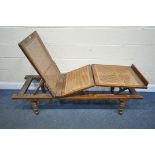 A LATE VICTORIAN MAHOGANY CAMPAIGN DAY BED, labelled Leveson & Sons of London, with bergère work,