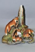 A BOEHM SCULPTURE OF A FAMILY OF FOXES, in a naturalistic woodland setting, limited edition, from