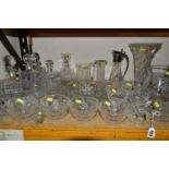 A GROUP OF ASSORTED GLASSWARE, including four decanters and stoppers, a cracker barrel and cover,