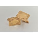 A PAIR OF 9CT GOLD CUFFLINKS, each of a rectangular form with a floral pattern and vacant cartouche,