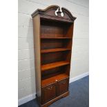 A ROSSMORE FURNITURE OPEN BOOKCASE, with three adjustable shelves, and double cupboard doors,