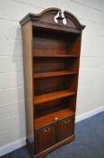 A ROSSMORE FURNITURE OPEN BOOKCASE, with three adjustable shelves, and double cupboard doors,