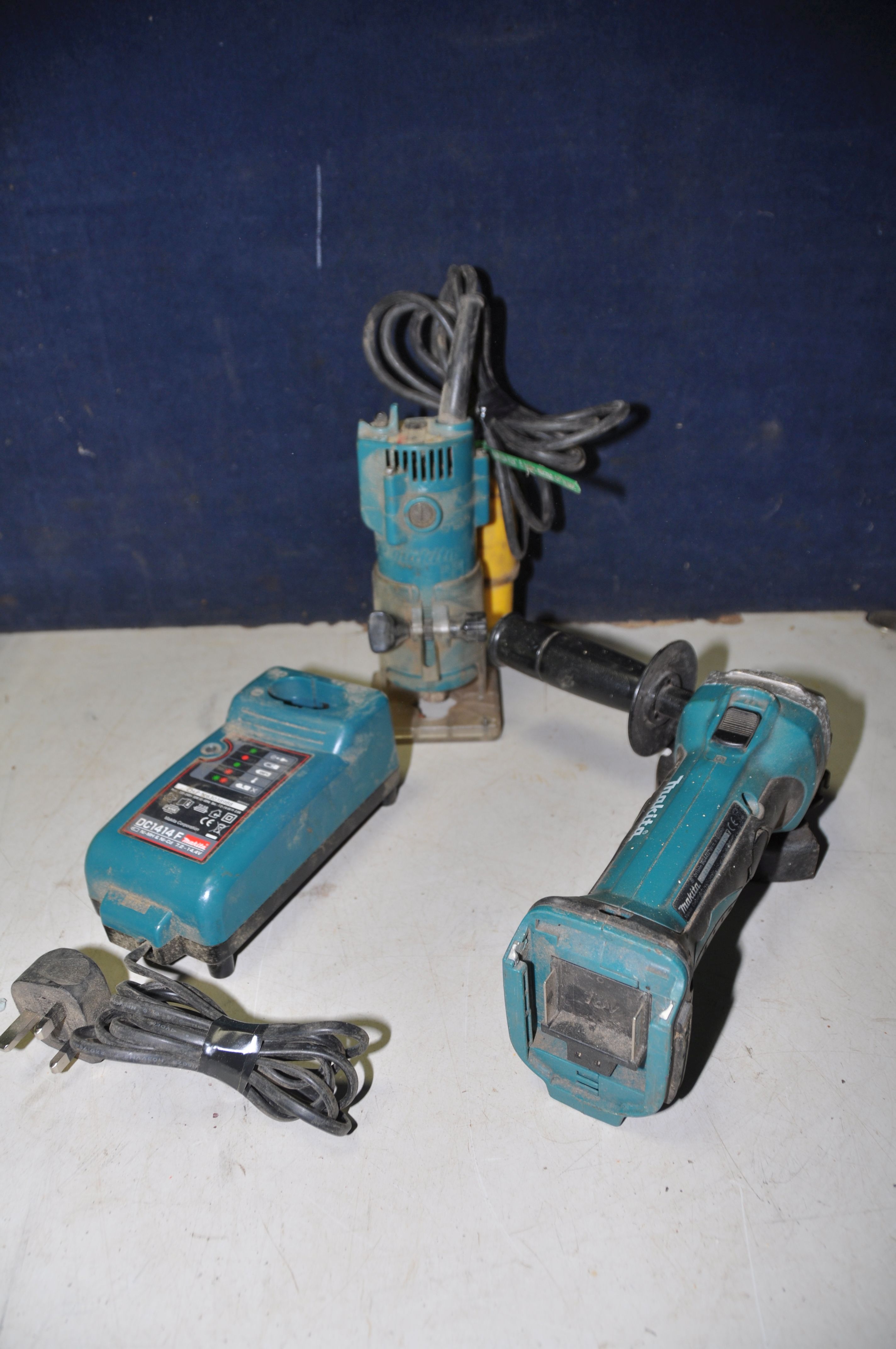 A MAKITA 3703 ROUTER along with a Makita BGA452 cordless angle grinder (no battery) and a Makita