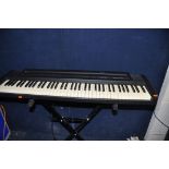 A ROLAND EP-7e DIGITAL PIANO with cover pedal and stand (PAT pass and working)