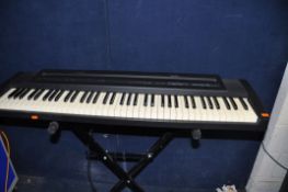 A ROLAND EP-7e DIGITAL PIANO with cover pedal and stand (PAT pass and working)