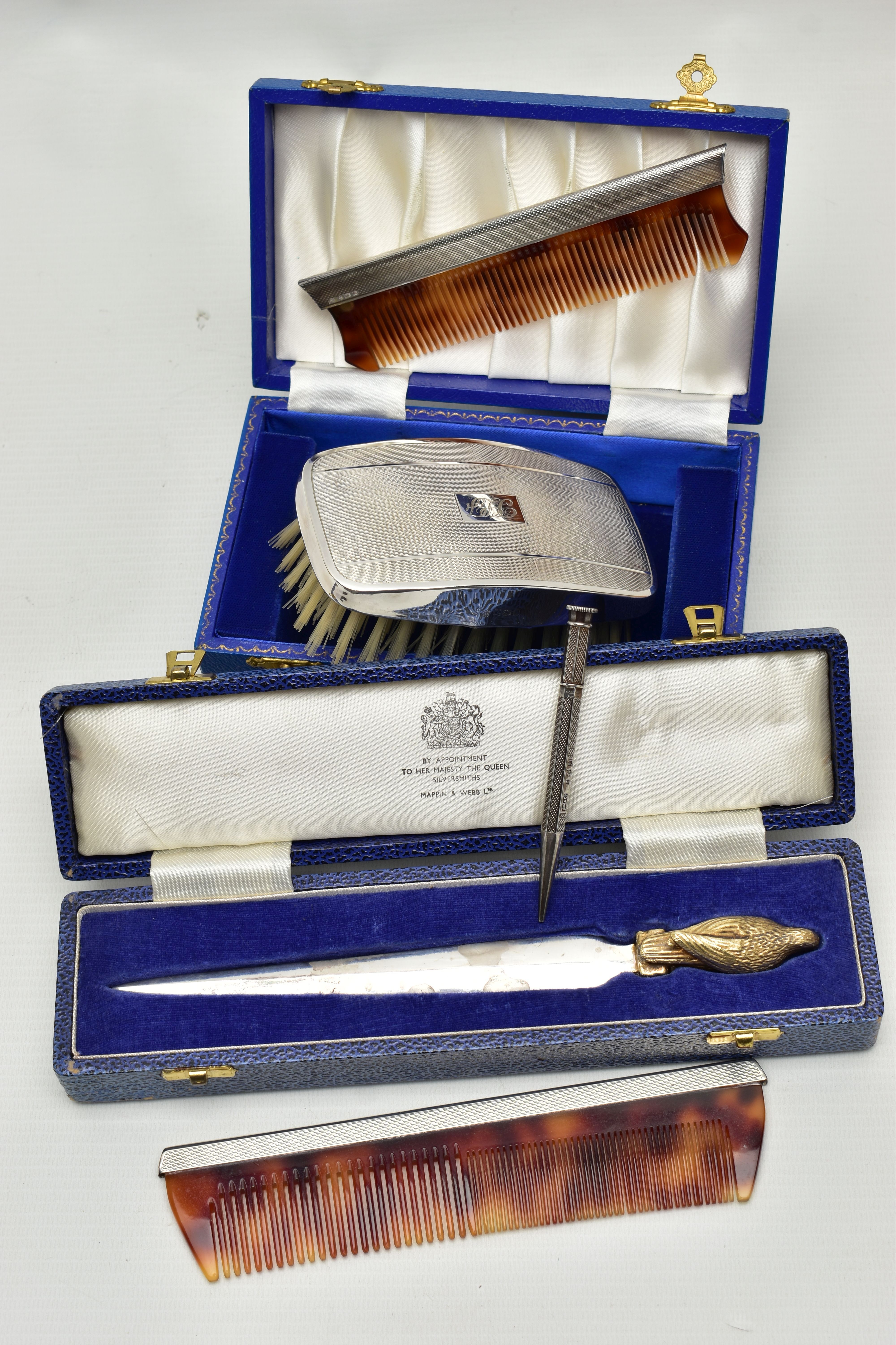 FOUR PIECES OF SILVER ITEMS, to include a boxed commemorative 'Mappin & Webb' letter opener
