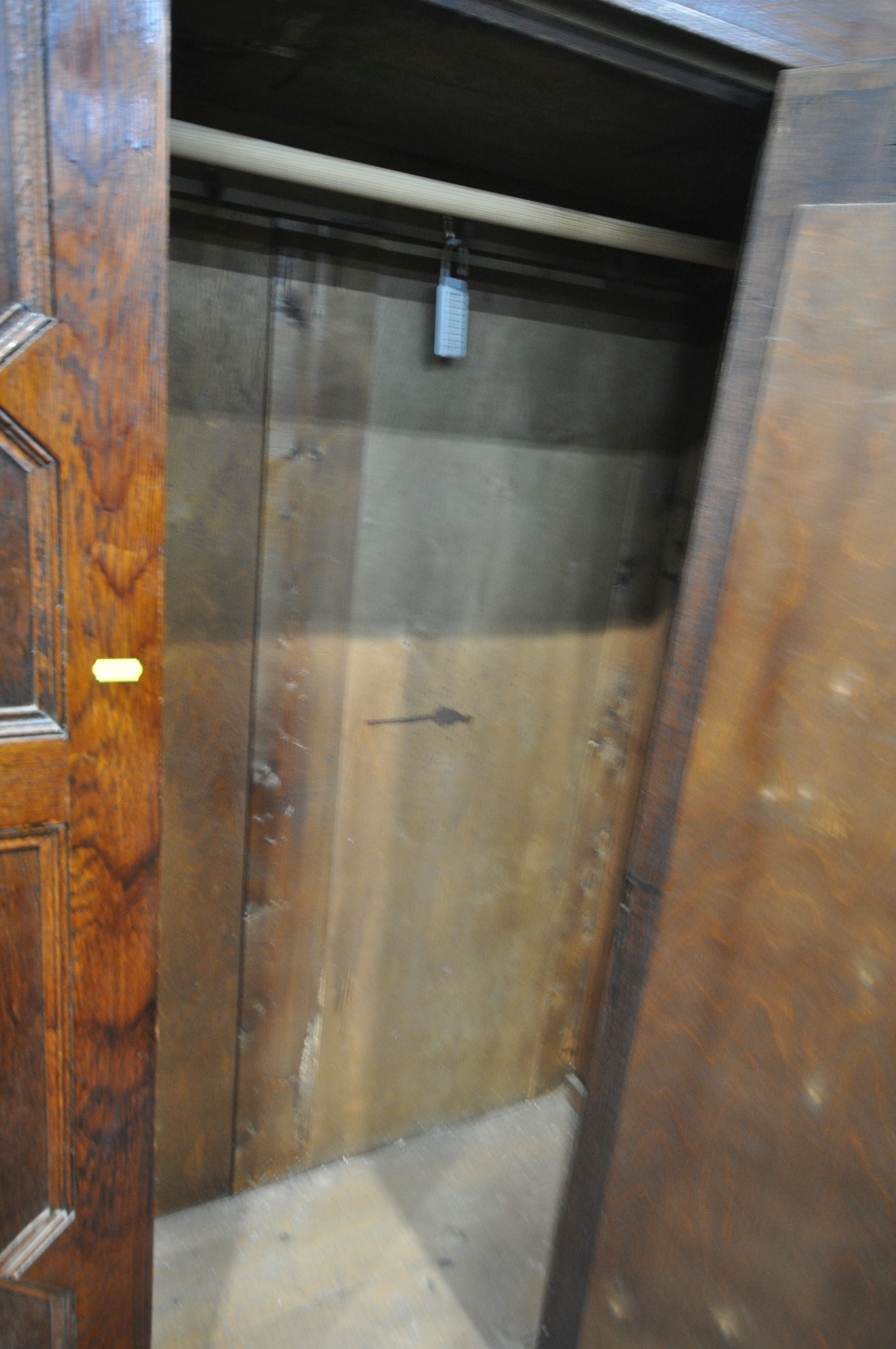 A VICTORIAN WALNUT WARDROBE, with an overhanging cornice, a single mirrored door, above a single - Image 4 of 4