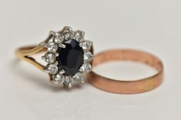 TWO 9CT GOLD RINGS, the first an oval cluster ring, centring on a four claw set, oval cut deep