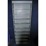 A SET OF STEEL SHELVING with nine shelves measuring width 67cm x depth 27cm x height 189cm and a