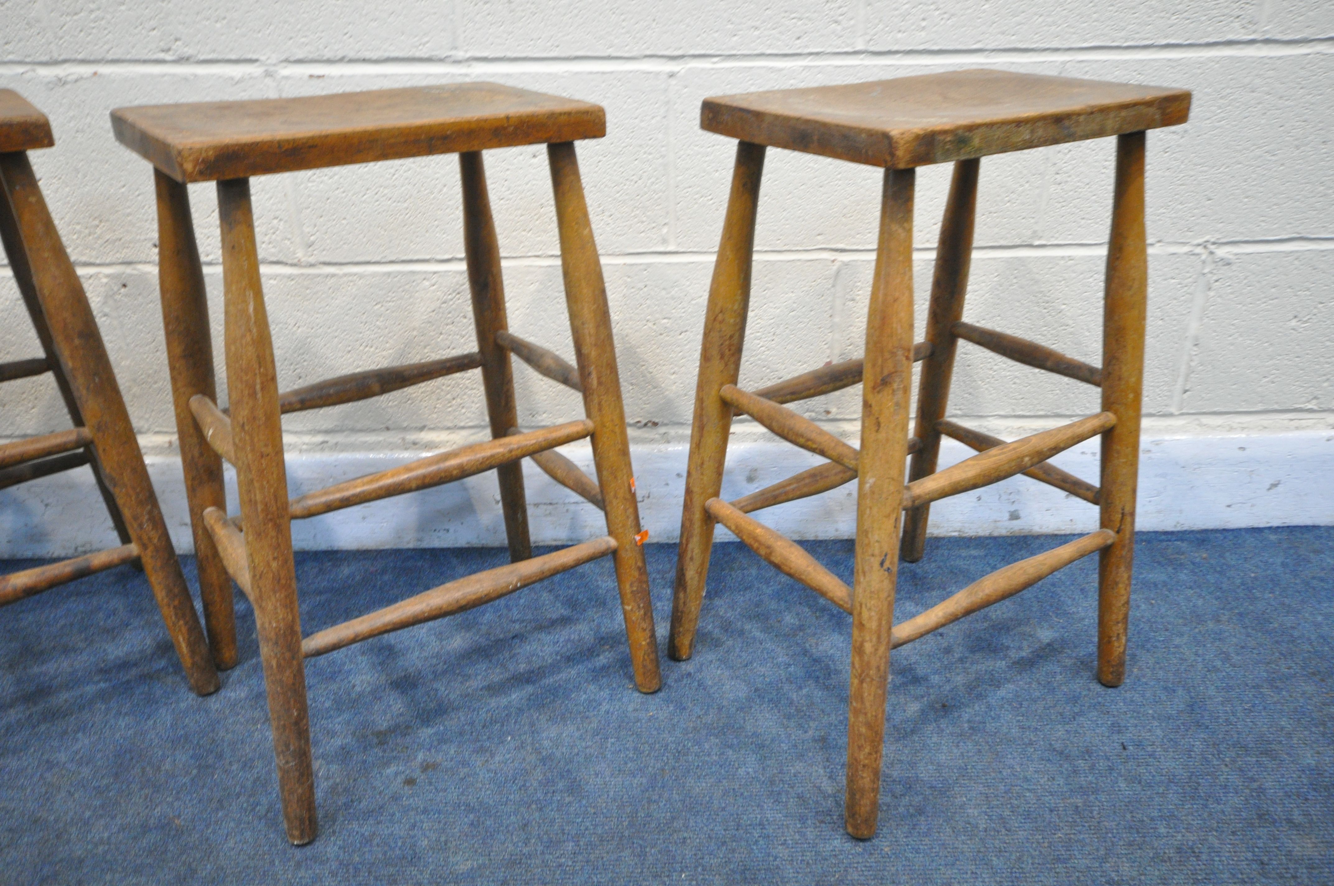 A SET OF FOUR BEECH LABRATORY STOOLS (condition:-distressed finish to all chairs) - Image 2 of 3