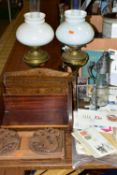 A GROUP OF OIL LAMPS, SMALL STAMP COLLECTION AND WOODEN BOOK STANDS, comprising an Oriental carved