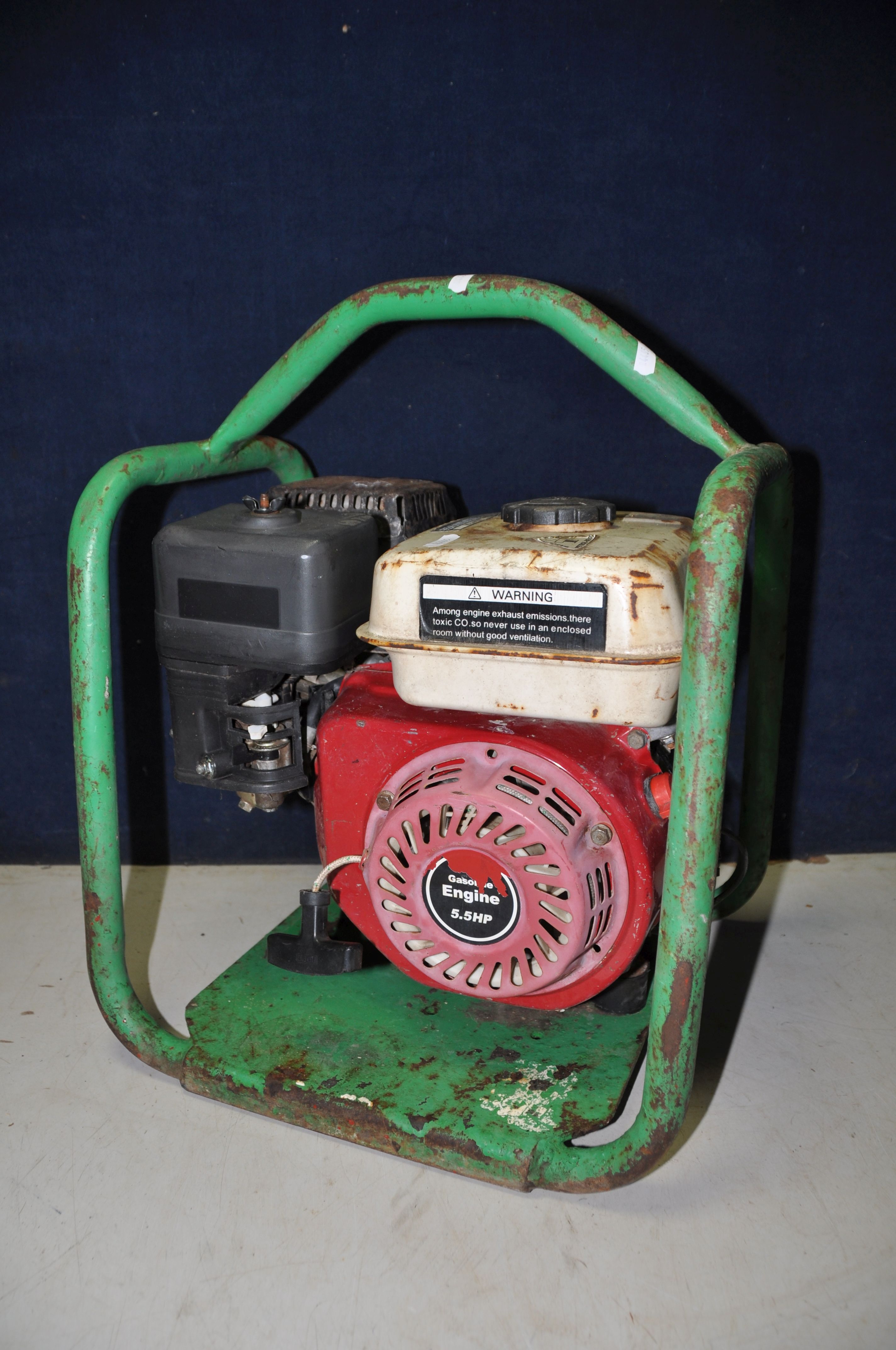 A PETROL GENERATOR engine and model Unkown, enclosed in a tubular frame (UNTESTED but engine pulling
