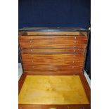 A ENGINEERS TOOL CHEST with hinged fall front and enclosing eight graduating draws (missing a draw