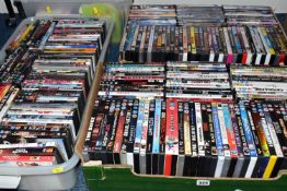 FOUR BOXES OF DVDS, approximately one hundred and eighty DVDs, mainly feature films, with some TV