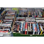 FOUR BOXES OF DVDS, approximately one hundred and eighty DVDs, mainly feature films, with some TV