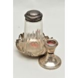A SILVER NUT DISH, SUGAR CASTER AND A CANDLESTICK, a round dish with pierecd rasied rim,