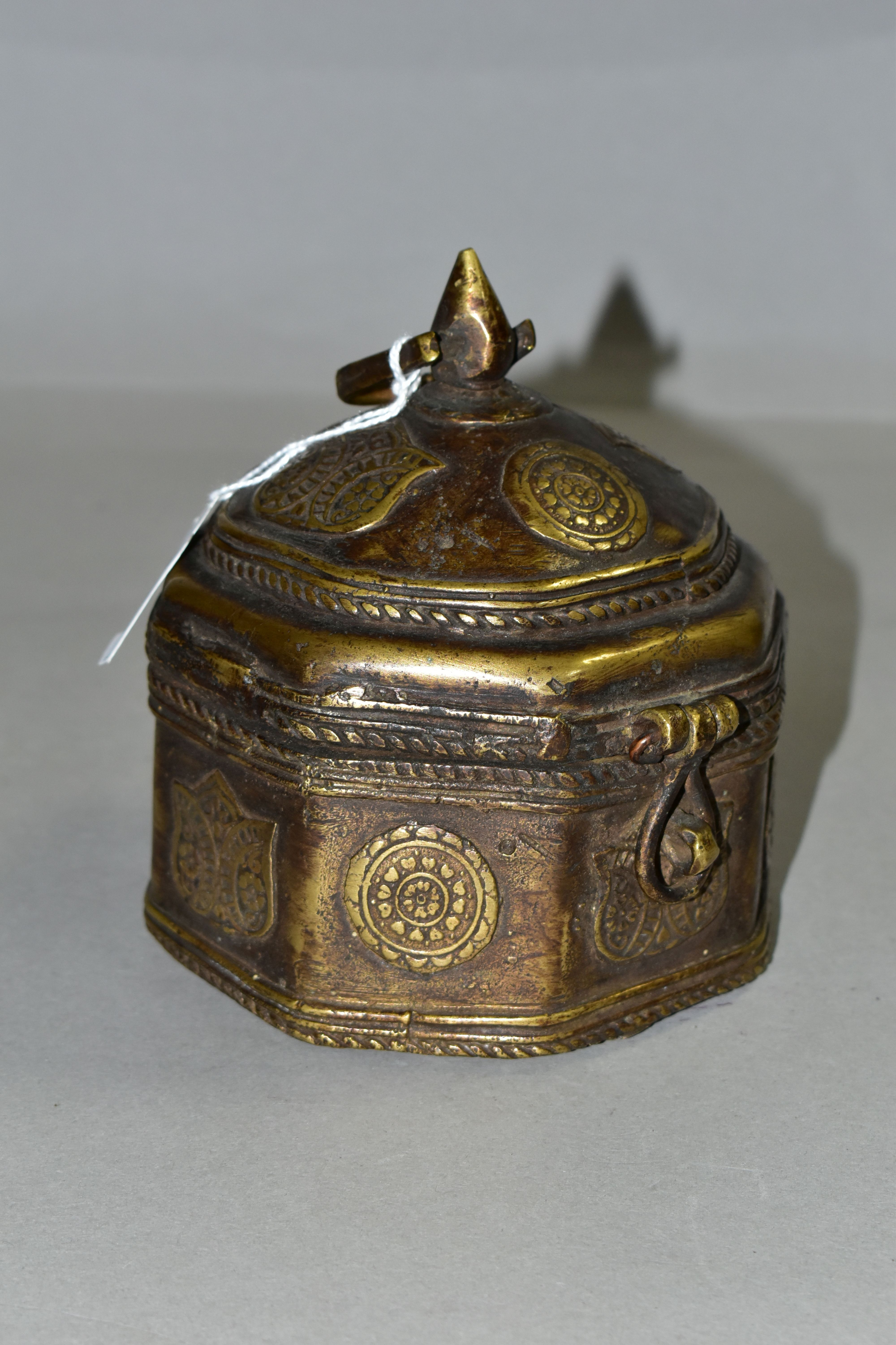 A BRONZE OCTAGONAL BOX, with domed lid, teardrop shaped finial and handle, applied flower symbols,