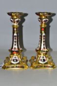 A PAIR OF ROYAL CROWN DERBY 1128 'SOLID GOLD BAND' CANDLESTICKS, of tapering form, the octagonal