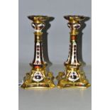 A PAIR OF ROYAL CROWN DERBY 1128 'SOLID GOLD BAND' CANDLESTICKS, of tapering form, the octagonal