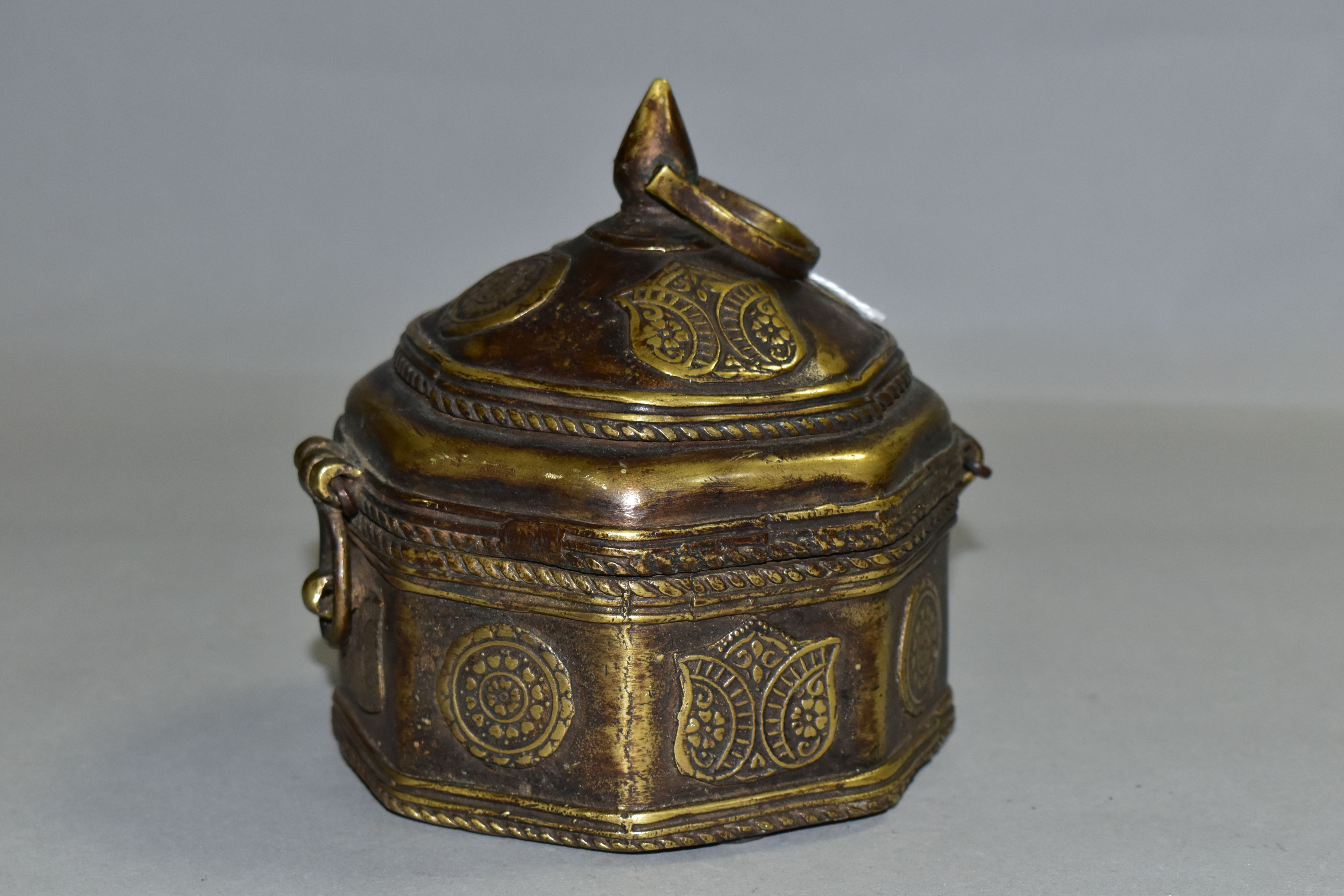 A BRONZE OCTAGONAL BOX, with domed lid, teardrop shaped finial and handle, applied flower symbols, - Image 2 of 5