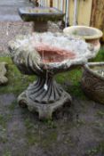 A MODERN COMPOSITE BIRD BATH in the form of an Oyster shell bowl on a linen swag base with four