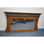 A LATE 19TH/EARLY 20TH CENTURY OAK BEVELLED EDGE OVERMANTEL MIRROR, top section with foliate carving