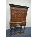 A PART QUEEN ANNE OAK AND CROSSBANDED CHEST ON STAND, with a fixed overhanging cornice, two short