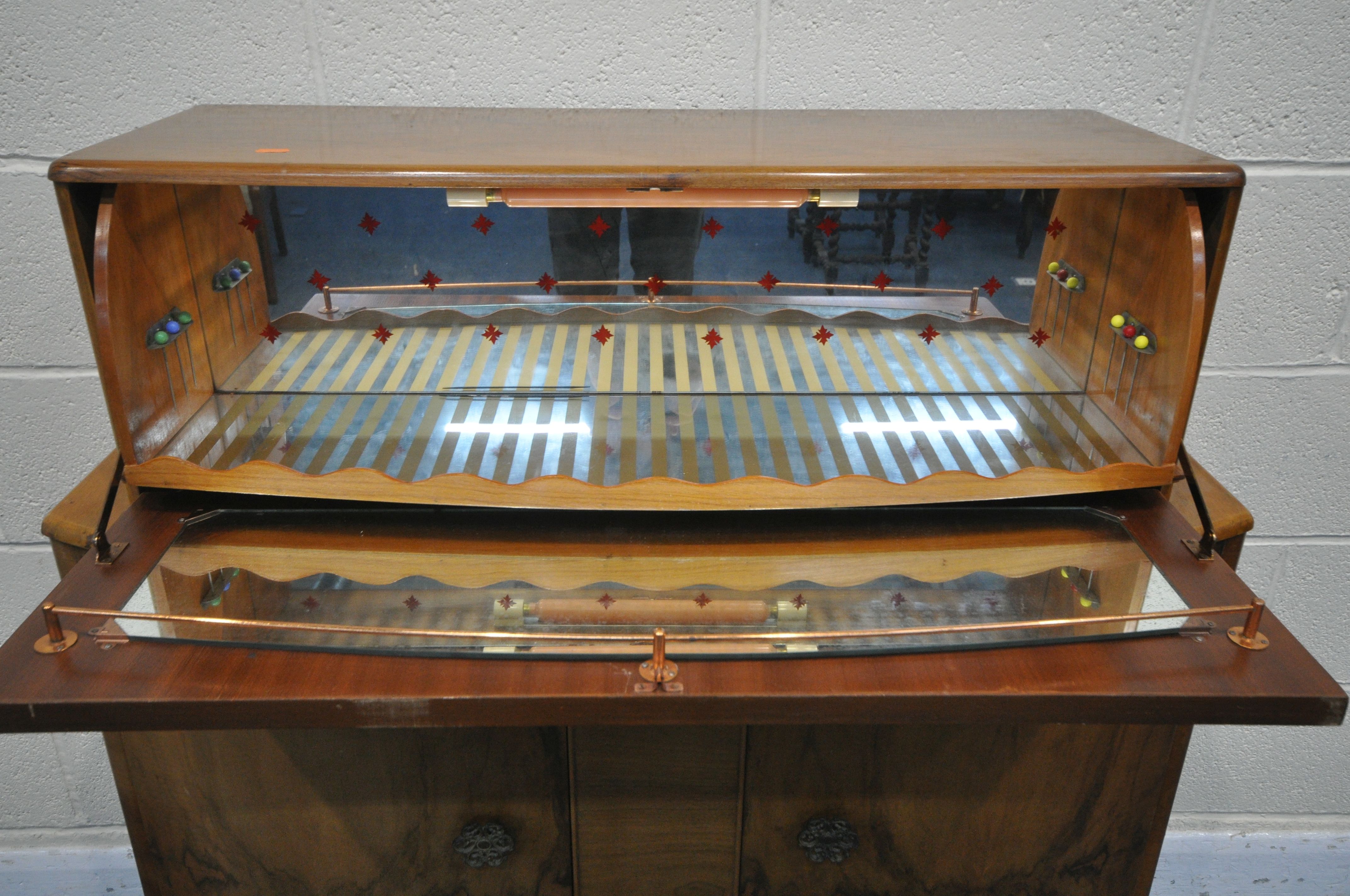 A SURELINE ART DECO STYLE WALNUT DRINKS CABINET, with a metamorphic fall front mirrored section, - Image 2 of 5