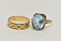 TWO 9CT GOLD RINGS, the first designed with a double four claw set, oval cut light blue topaz, in an