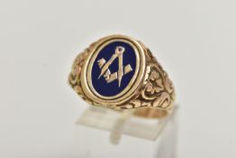 A HEAVY 9CT GOLD MASONIC ENAMEL RING, of an oval form decorated with blue enamel, scrolling embossed