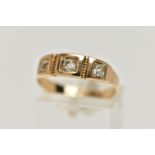 A YELLOW METAL THREE STONE DIAMOND RING, set with three old cut diamonds, each four claw set in a