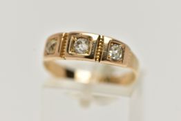 A YELLOW METAL THREE STONE DIAMOND RING, set with three old cut diamonds, each four claw set in a