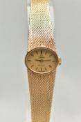 A LADYS 9CT GOLD 'OMEGA' WRISTWATCH, manual wind, oval gold dial signed 'Omega De Ville', baton