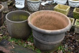 A LARGE WEATHERED TERRACOTTA PLANTER, diameter 72cm x height 57cm, along with another circular