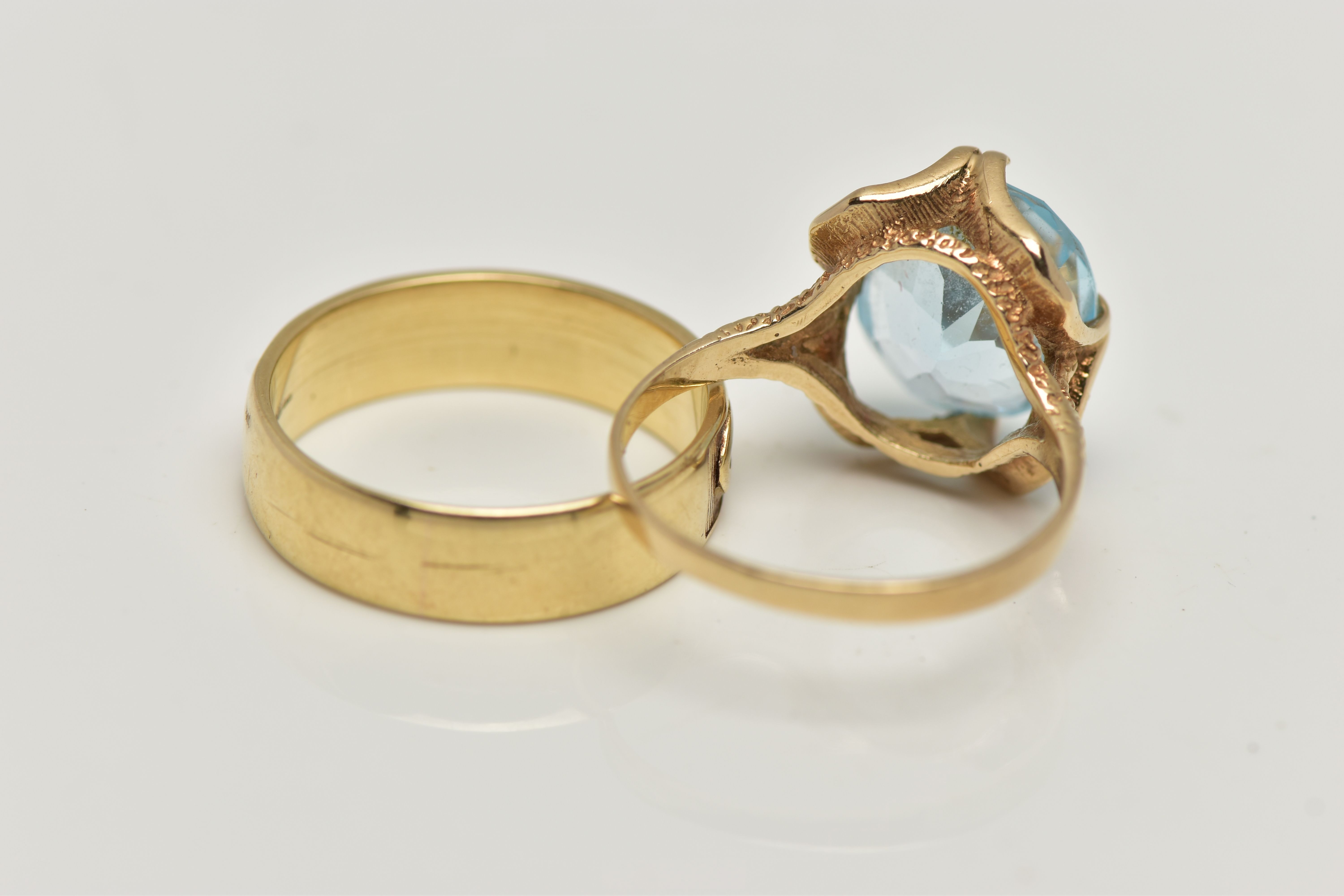 TWO 9CT GOLD RINGS, the first designed with a double four claw set, oval cut light blue topaz, in an - Image 4 of 4