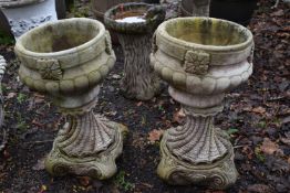 A PAIR OF WEATHERED COMPOSITE COMPAGNA GARDEN URNS, on a separate neo classical base, diameter