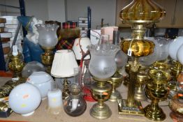 A QUANTITY OF LAMPS AND SHADES, oil lamps and electric table lamps, to include a tall Duplex oil