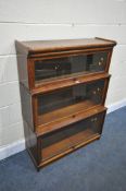 AN EARLY 20TH CENTURY OAK GLOBE-WERNICKE CO LTD, LONDON, THREE SECTION BOOKCASE, with glass fall