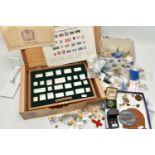 A CASED SET OF SILVER STAMPS AND A BOX OF PIN BADGES, 'The Stamps of Royalty' silver stamp