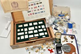A CASED SET OF SILVER STAMPS AND A BOX OF PIN BADGES, 'The Stamps of Royalty' silver stamp