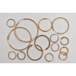 A BAG OF ASSORTED YELLOW METAL HOOP EARRINGS, five pairs of hollow hoops, three single hoops,