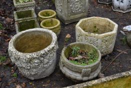 A WEATHERED COMPOSITE OCTAGONAL PLANTER, diameter 39cm x height 27cm, a circular floral planter, and