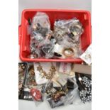 A RED PLASTIC BOX OF ASSORTED COSTUME JEWELLERY AND ITEMS, to include various beaded necklaces,