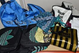 A GROUP OF SEVEN VINTAGE HOLDALLS, comprising a nylon Touche Ross, blue and white Adidas, black