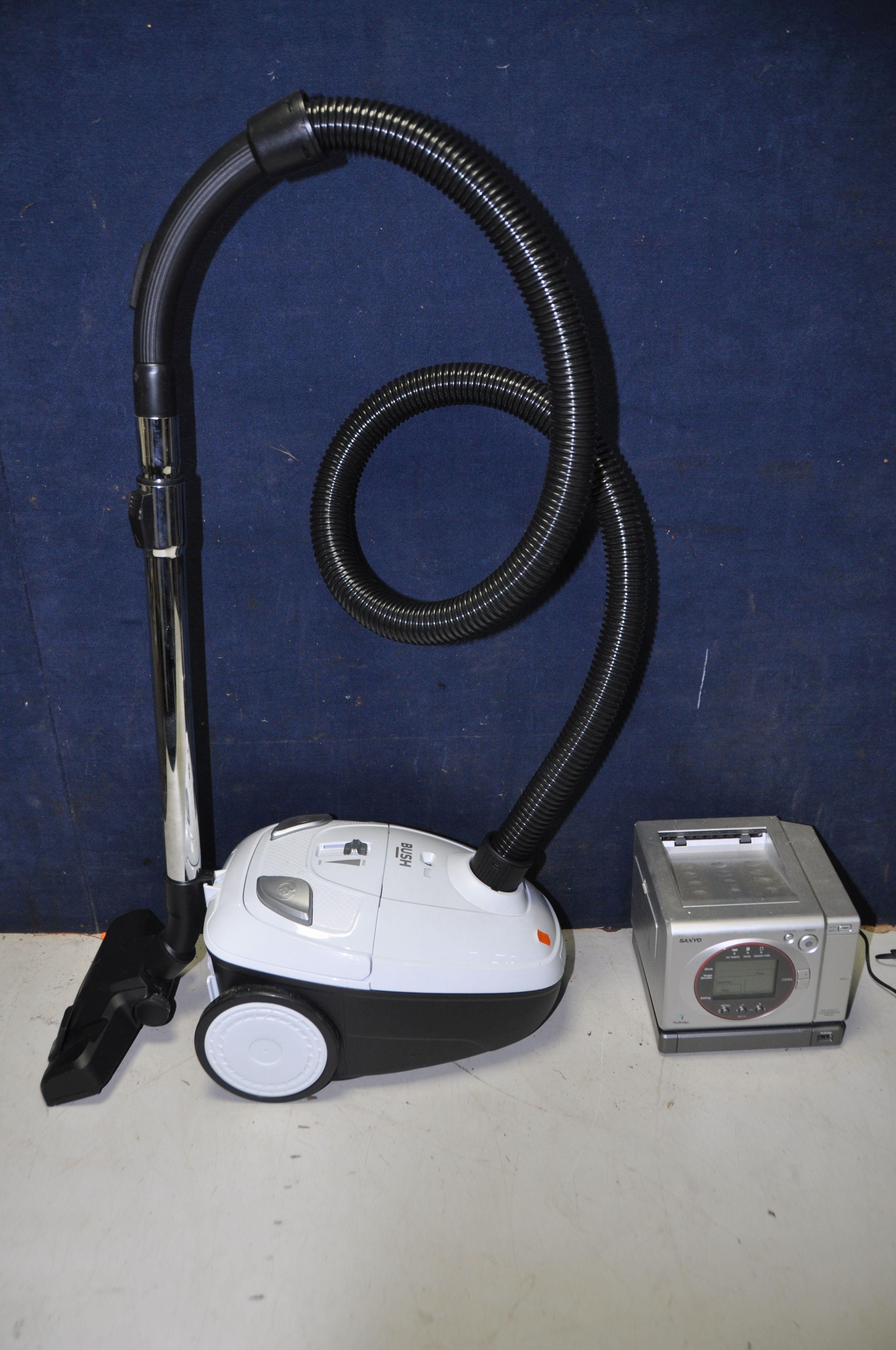 A BUSH VCB35B15C VACUUM CLEANER along with a Sanyo DVP-P1EX printer (both UNTESTED) (2)
