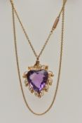 A YELLOW METAL AMETHYST PENDANT NECKLACE, heart cut amethyst, milgrain collet set within a