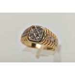 A 9CT GOLD DIAMOND SIGNET RING, of a square outline, set with nine single cut diamonds, estimated