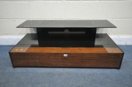 A BLACK TEMPERED GLASS TV STAND, with a fall front door, width 110cm x depth 53cm x height 39cm,