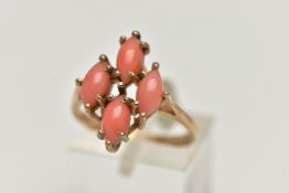 A 9CT GOLD CORAL RING, four marquise cabochon coral stones set as a cluster in a yellow gold