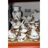 A ROYAL ALBERT 'OLD COUNTRY ROSES' PATTERN TEA SET, comprising a teapot (cracked lid), cake plate,